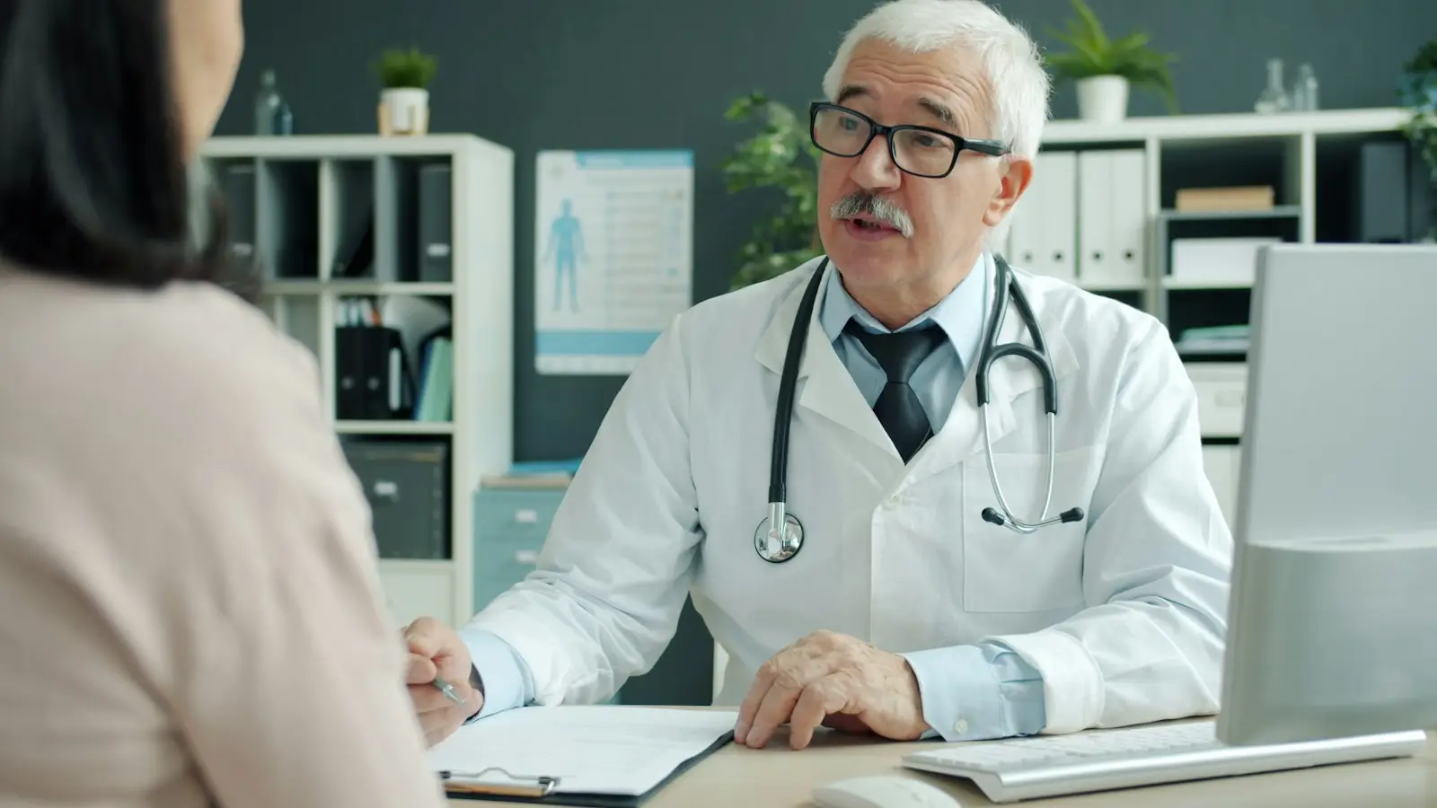 A doctor talking with a patient in a clinic